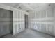 Large living room with concrete floors under construction with open doorway at 1646 Cane Bamboo Drive, St Cloud, FL 34771