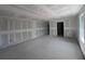 Open living room with concrete floors under construction and natural light at 1646 Cane Bamboo Drive, St Cloud, FL 34771