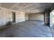 Expansive living room featuring concrete flooring, block walls, and an open floor plan at 1646 Cane Bamboo Drive, St Cloud, FL 34771