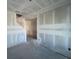Unfinished living space featuring bare walls and concrete floors, ready for customization and finishing touches at 1646 Cane Bamboo Drive, St Cloud, FL 34771