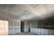 Spacious open-concept living room with drywall and unfinished ceilings at 1646 Cane Bamboo Drive, St Cloud, FL 34771