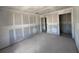 Spacious living room under construction with smooth concrete floors and ample natural light at 1646 Cane Bamboo Drive, St Cloud, FL 34771