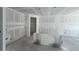 Unfinished living area featuring large glass doors and windows, providing ample natural light and outdoor access at 1646 Cane Bamboo Drive, St Cloud, FL 34771