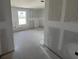 Unfinished living room showing drywall and a window at 1646 Cane Bamboo Drive, St Cloud, FL 34771