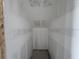 Unfinished walk-in closet shows drywall and a concrete floor at 1646 Cane Bamboo Drive, St Cloud, FL 34771