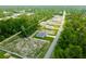 A high aerial shot showcases a single-Gathering home amid lush woods, emphasizing its peaceful setting at 17301 Sw 41St Cir, Ocala, FL 34473