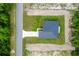 High aerial shot shows single-Gathering home with a well-manicured lawn surrounded by undeveloped lots and woods at 17301 Sw 41St Cir, Ocala, FL 34473