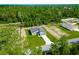 Aerial view displaying a single-Gathering home with a well-manicured lawn in a serene, wooded neighborhood at 17301 Sw 41St Cir, Ocala, FL 34473