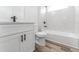 Modern bathroom with vanity, toilet, and tiled shower/tub combination at 17301 Sw 41St Cir, Ocala, FL 34473