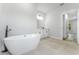 Bathroom features modern soaking tub and vanity at 17301 Sw 41St Cir, Ocala, FL 34473