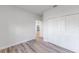 Bedroom view showcasing closet, wood-look floors, and white walls at 17301 Sw 41St Cir, Ocala, FL 34473