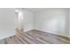 Bedroom with wood-look flooring and a doorway leading to another room at 17301 Sw 41St Cir, Ocala, FL 34473