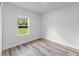 Bedroom featuring light gray floors, white walls, and natural light at 17301 Sw 41St Cir, Ocala, FL 34473