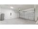 Spacious two car garage featuring white walls and concrete flooring at 17301 Sw 41St Cir, Ocala, FL 34473