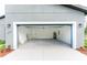 Home exterior view featuring an open garage with a white trim at 17301 Sw 41St Cir, Ocala, FL 34473