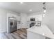 Modern kitchen featuring stainless appliances, white cabinetry, and quartz countertops at 17301 Sw 41St Cir, Ocala, FL 34473