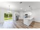 Modern kitchen seamlessly blends with the living area, featuring stainless appliances and ample counter space at 17301 Sw 41St Cir, Ocala, FL 34473