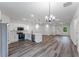Open-concept kitchen and living area with island, stainless appliances, and modern finishes at 17301 Sw 41St Cir, Ocala, FL 34473