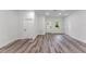Bright living room with modern gray flooring, white walls, and natural light from windows at 17301 Sw 41St Cir, Ocala, FL 34473