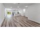 Bright, open living space flows into a modern kitchen, complete with wood flooring and plenty of natural light at 17301 Sw 41St Cir, Ocala, FL 34473