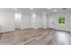 Bright, open living space with white walls, modern wood flooring, and plenty of natural light at 17301 Sw 41St Cir, Ocala, FL 34473