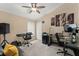 Versatile bedroom featuring a keyboard, dual desk setup, and neutral walls at 182 Westmoreland Cir, Kissimmee, FL 34744