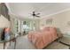 Bright bedroom with bay windows, neutral walls, ceiling fan, and a comfortable bed at 182 Westmoreland Cir, Kissimmee, FL 34744