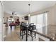 Dining room with modern lighting, a four-chair table, and an open view into the game room at 182 Westmoreland Cir, Kissimmee, FL 34744