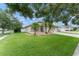 Well-maintained single-Gathering home featuring lush landscaping and a spacious lawn at 182 Westmoreland Cir, Kissimmee, FL 34744