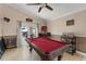 Entertain in the game room, featuring a wet bar, pool table and access to the patio at 182 Westmoreland Cir, Kissimmee, FL 34744