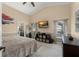 Spacious main bedroom featuring high ceilings, and a large window for natural light at 182 Westmoreland Cir, Kissimmee, FL 34744