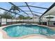 Screened-in pool and spa with entertainment bar area, perfect for outdoor living at 182 Westmoreland Cir, Kissimmee, FL 34744