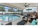 Beautiful screened-in pool and spa with outdoor bar area, perfect for entertaining at 182 Westmoreland Cir, Kissimmee, FL 34744