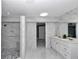 Elegant bathroom with marble tiling, dual vanity sinks, and glass enclosed shower and a jetted tub at 1836 Se 6Th Ave, Ocala, FL 34471