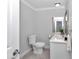 Bathroom featuring toilet, modern vanity with sink, and stylish gray tile flooring at 1836 Se 6Th Ave, Ocala, FL 34471