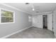Spacious bedroom featuring a closet, gray walls, tiled flooring, and a ceiling fan at 1836 Se 6Th Ave, Ocala, FL 34471