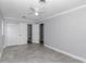 Spacious bedroom featuring a closet, gray walls, tiled flooring, and a ceiling fan at 1836 Se 6Th Ave, Ocala, FL 34471