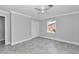 Bedroom featuring a closet, gray walls, tiled flooring, and a ceiling fan at 1836 Se 6Th Ave, Ocala, FL 34471