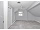 Bedroom with sleek grey paint, tiled floors, and a window offering natural light at 1836 Se 6Th Ave, Ocala, FL 34471