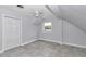 This bedroom has tile flooring, a window, and a ceiling fan at 1836 Se 6Th Ave, Ocala, FL 34471