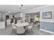 Open concept dining room overlooking the kitchen with gray tile and pendant lighting at 1836 Se 6Th Ave, Ocala, FL 34471