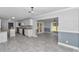 Open concept dining area overlooking the kitchen, showcasing the gray tile flooring at 1836 Se 6Th Ave, Ocala, FL 34471