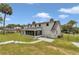 Rear exterior view featuring a screened in porch and fenced in yard at 1836 Se 6Th Ave, Ocala, FL 34471