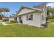 Stylish home exterior with dark shutters, a well-manicured lawn and trimmed shrubs at 1836 Se 6Th Ave, Ocala, FL 34471