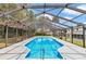 A sparkling pool enclosed by a screened-in lanai at 1836 Se 6Th Ave, Ocala, FL 34471