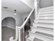Elegant staircase with black wrought iron and modern lighting at 1836 Se 6Th Ave, Ocala, FL 34471