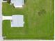 Aerial shot of home showcasing lush lawn and roof; set within a suburban landscape at 200 Cimarron Dr, Kissimmee, FL 34759
