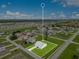 Highlighted property with expansive lawn in a residential area; aerial view for a sense of location at 200 Cimarron Dr, Kissimmee, FL 34759