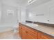 Bathroom with tub, vanity, sink, tile floor and neutral colored walls at 200 Cimarron Dr, Kissimmee, FL 34759