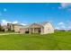 Home with a well-manicured lawn and a two car attached garage at 200 Cimarron Dr, Kissimmee, FL 34759